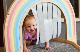 Infant child crawling in the infant/toddler transition classroom